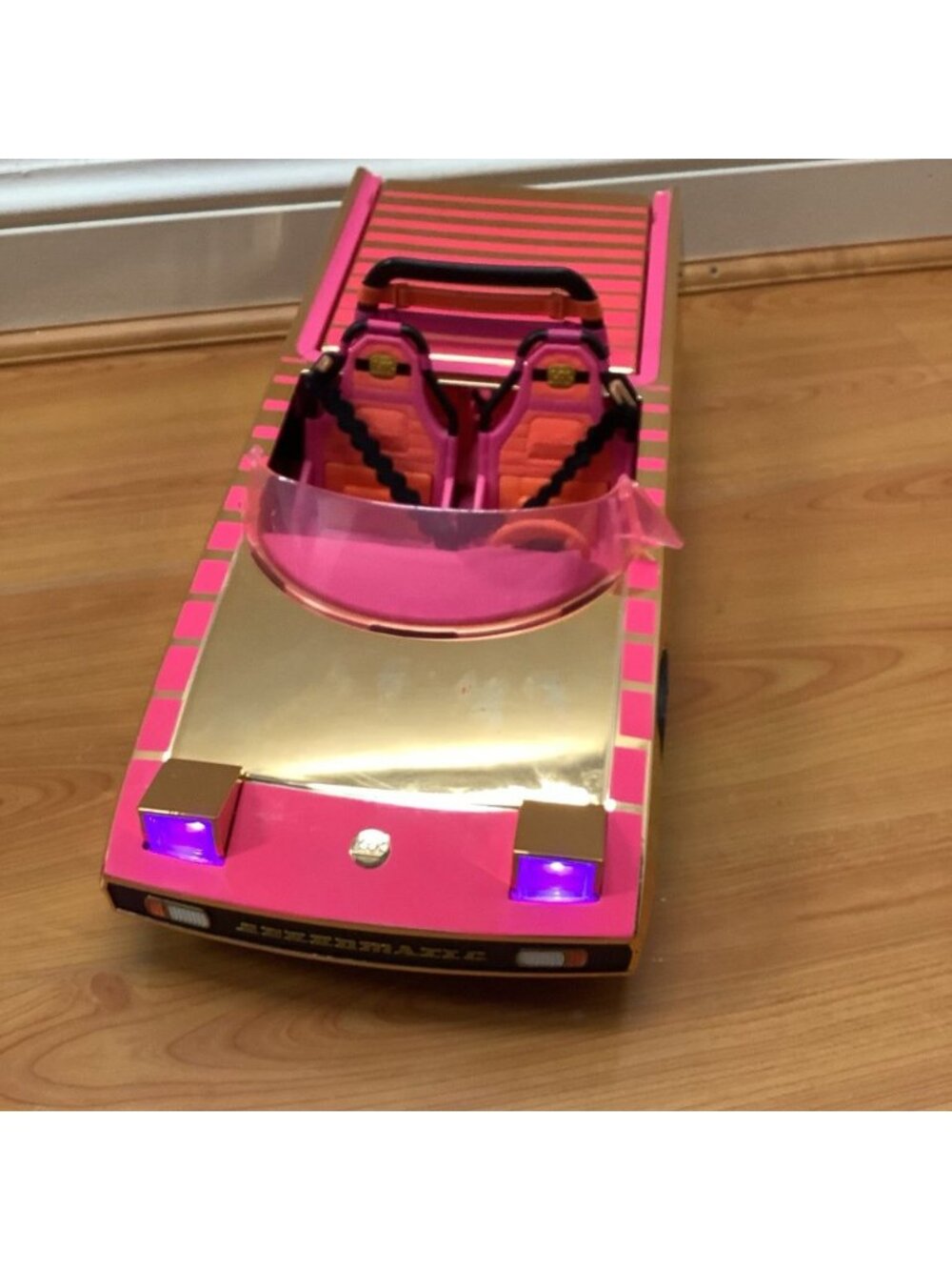 LOL Surprise! Car-pool Coupe Toy Car Playset with Black Light Headlights.